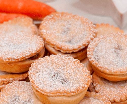 mincemeat sprinkled with caster sugar served in a wooden plate